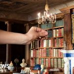 Queen updates royal Dolls' House with tiny modern books