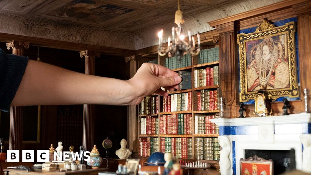 Queen updates royal Dolls' House with tiny modern books