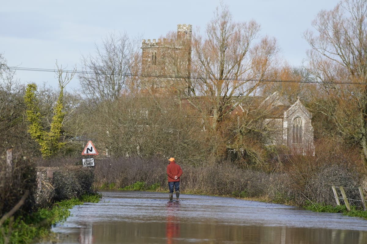 UK weather: Hundreds of flood warnings issued as heavy rainfall disrupts roads and railways - live