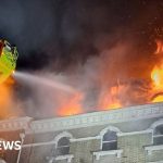 Eleven people injured in five-storey house blaze