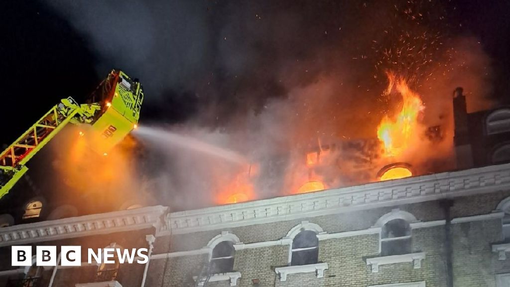 Eleven people injured in five-storey house blaze