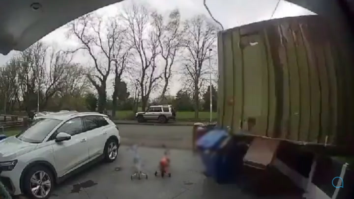 Crane crashes through roof of house as children play outside